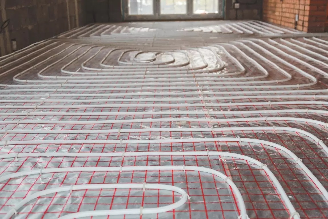 https://airsourceheatpumpmanchester.co.uk/wp-content/uploads/2025/10/Under-floor-Heating-1.jpg